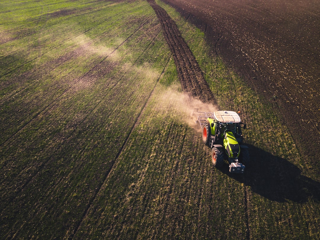 Farm tractor in a field illustrating agricultural property and equipment