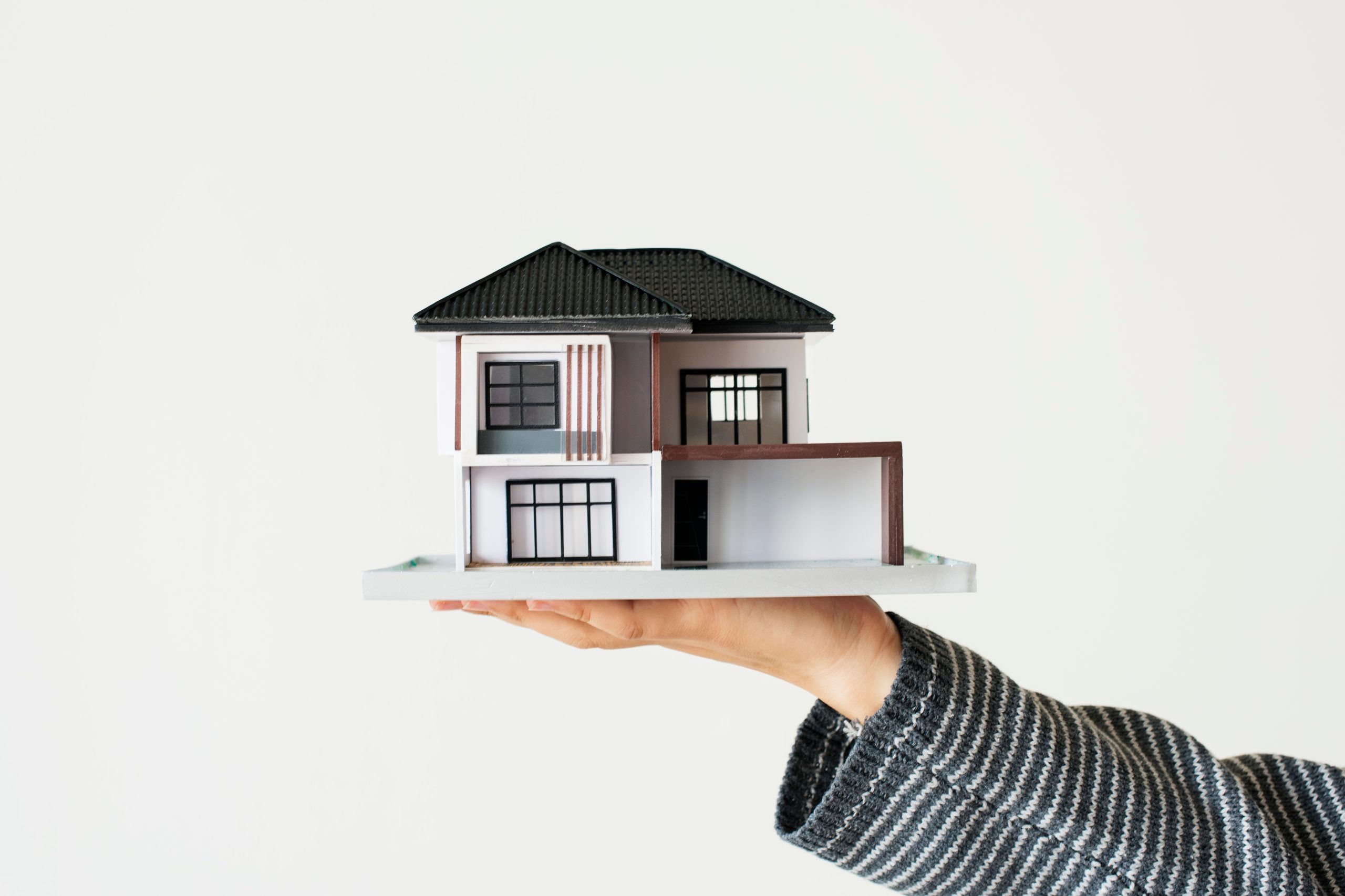 hand presenting model house home loan campaign hand presenting model house home loan campaign